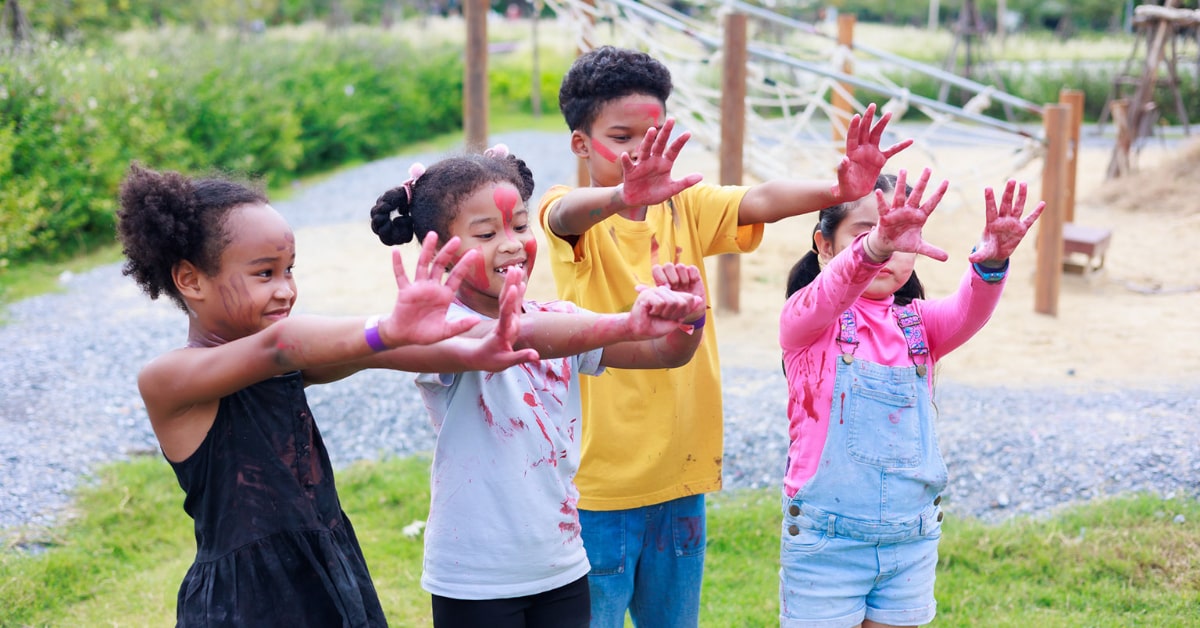 kids playing with paint at summer camp